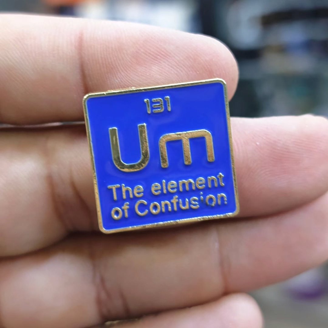 UM The Element Of Confusion Pins - Metal Pins